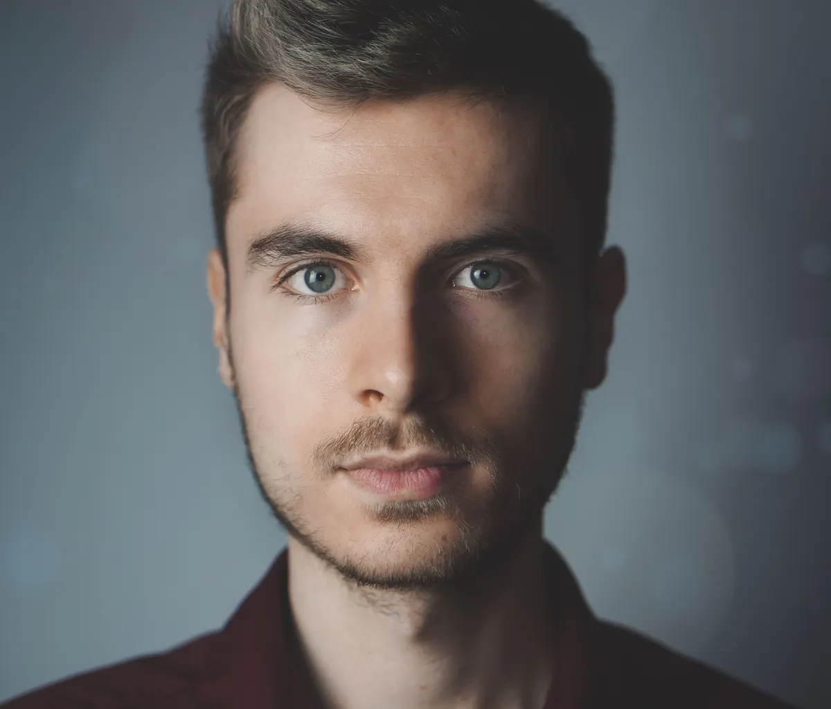 Professional LinkedIn headshot example — soft bokeh background